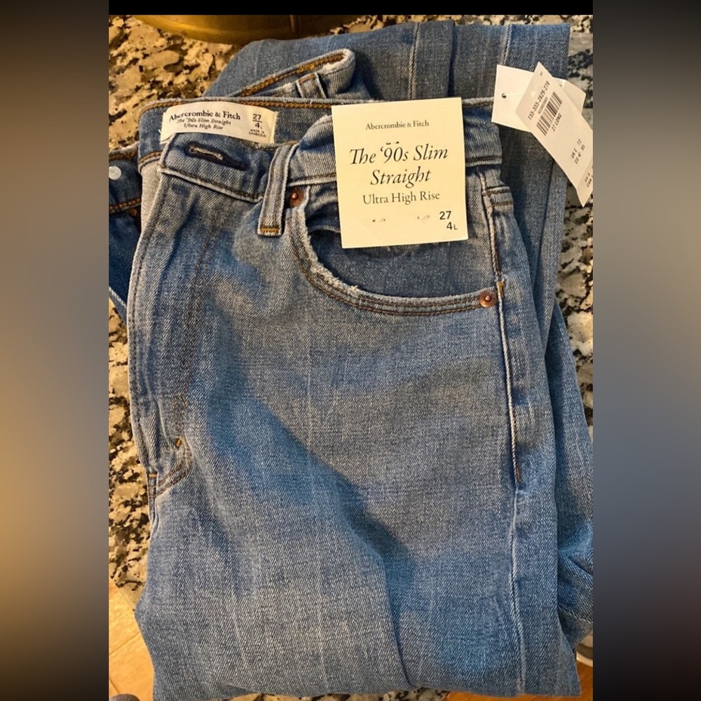 Wore a handful of times. Very flattering jeansto big.light medium wash. 27L